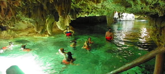 Tourists diving in the cenotes