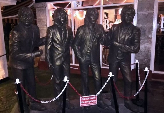 Statues of the beatles in the bar
