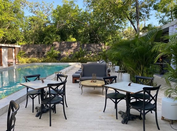 Tables by the pool in the restaurant