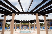 Jacuzzi surrounded by loungers in the hotel