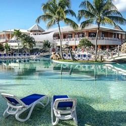 Pool view surrounded by sun loungers 