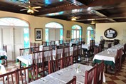 restaurant with wooden furniture and stained glass