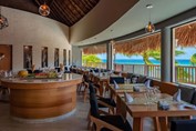 Restaurant with huge glass windows facing beach