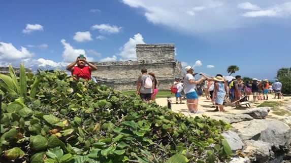Tourists walking through the archaeological zone