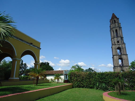 yellow colonial house and colonial tower