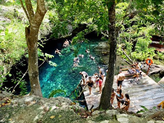 Tourists in the Gran Cenote, Tulum