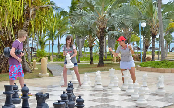 children playing with a giant chess