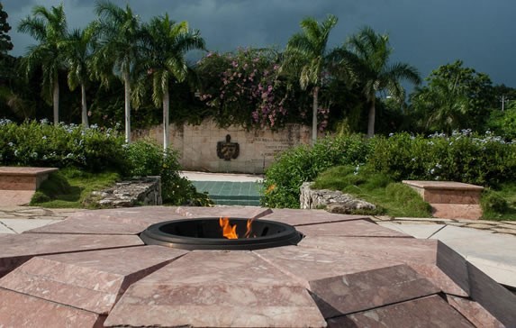 eternal flame monument surrounded by greenery