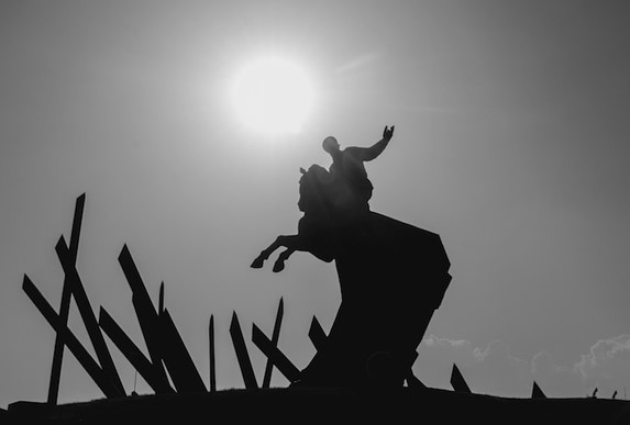 bronze sculpture at sunset