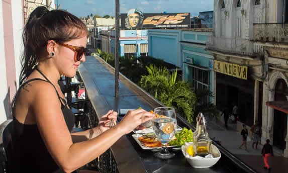 client enjoying her lunch on the balcony