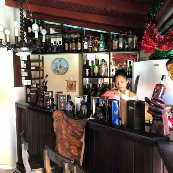 wooden bar full of bottles