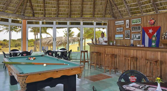 snack bar with pool table and wooden bar