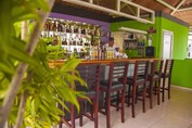 bar with wooden bar and high chairs