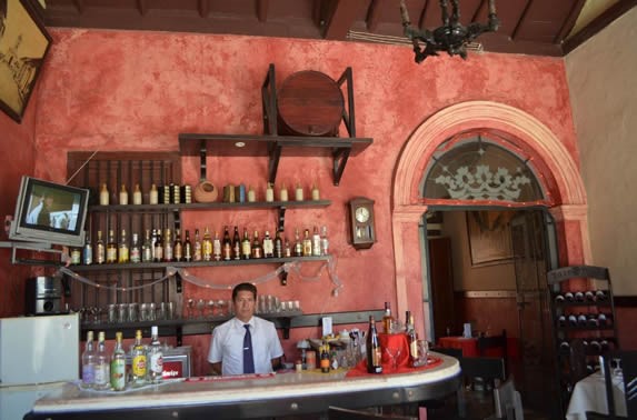 wooden bar with decorations and bottles