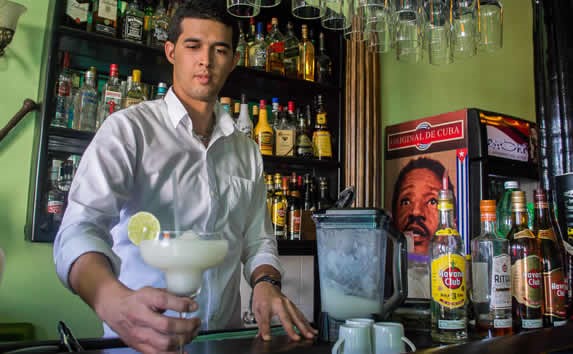 bartender at the bar preparing drinks