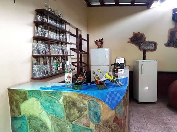 stone bar with bottles and mirror