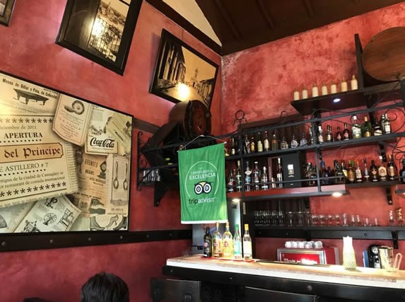 wooden bar with decorations and bottles