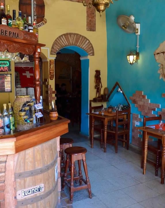 wooden bar and tables inside the restaurant