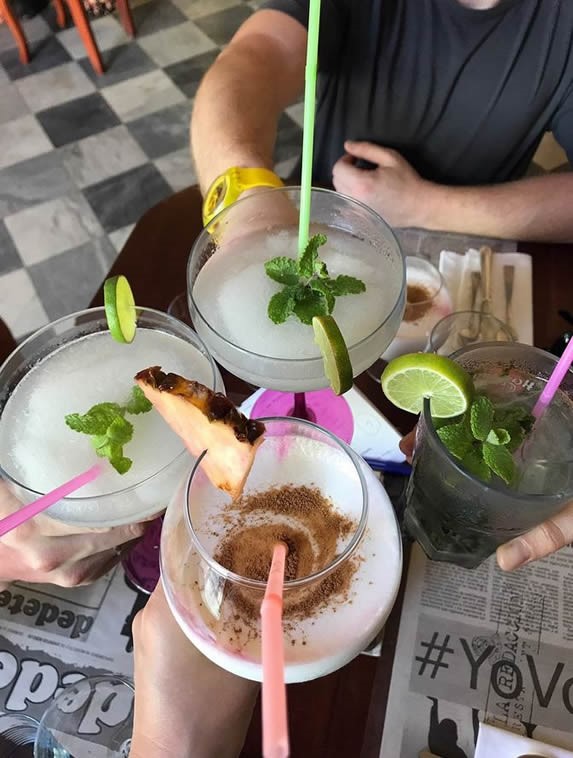 customers toasting with drinks