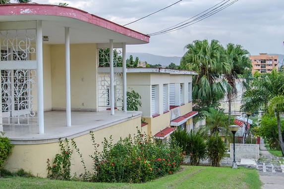 one-story house facade with garden