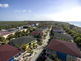 aerial view of bungalows surrounded by greenery