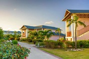 two-story bungalows surrounded by greenery