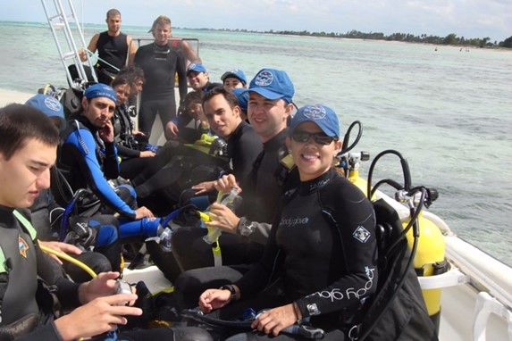 group of divers in small boat