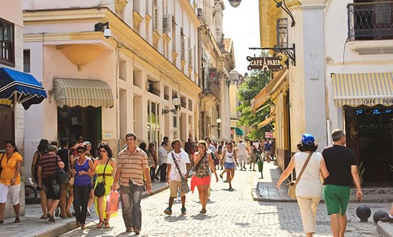 People walking down Obispo Street