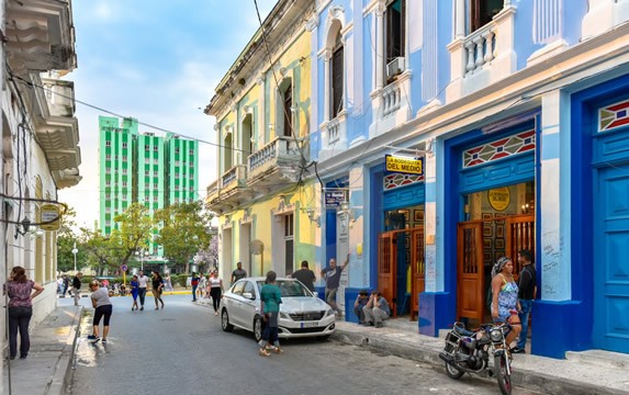 city street surrounded by buildings 