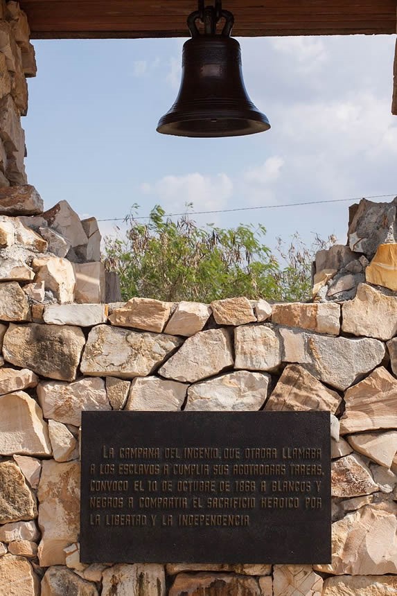 bell in rock construction with engraved plaque