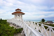 white wooden gazebo on the beach