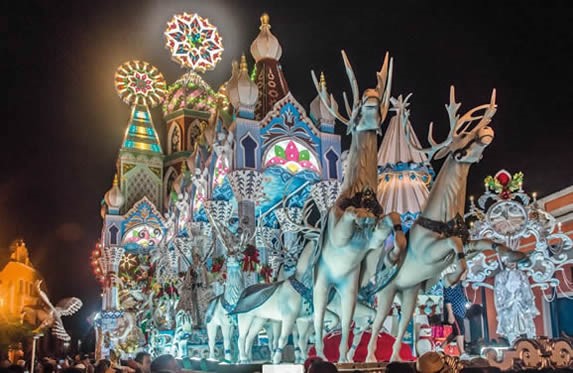 illuminated festival floats at night