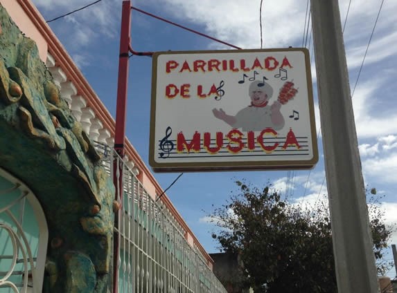 sign hanging at the entrance of the restaurant