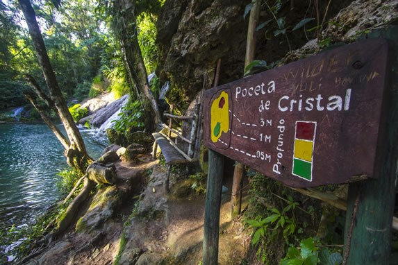 lagoon with wooden sign