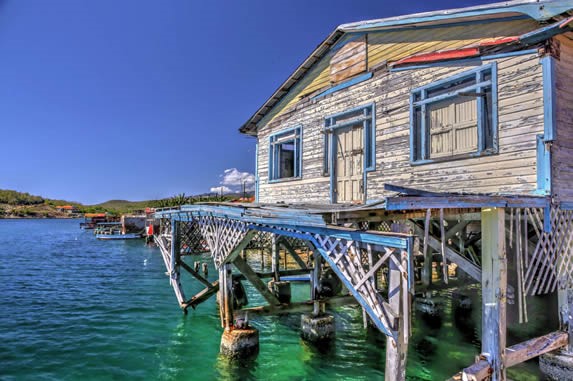 Wooden house over the bay.