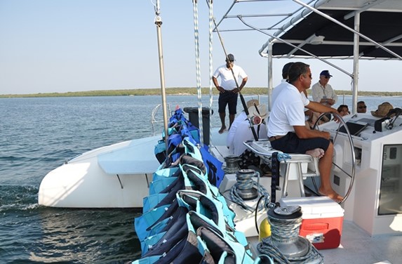 boat with employees and life jackets