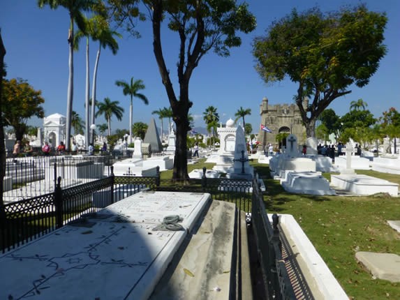 tombs and marble tombstones surrounded by greenery