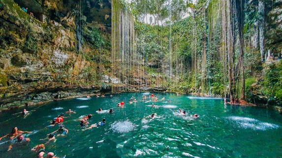 Cenote Ik Kil - Tourists swimming in the Cenote