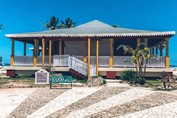 beachfront bar with white railings