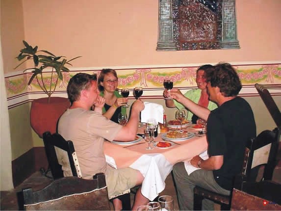 customers toasting at a restaurant table
