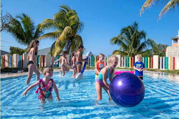 children playing in colorful children's pool