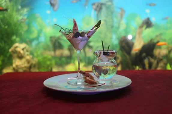 restaurant dish with fish tank in the background