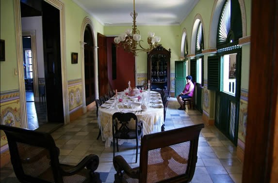 Dining room decorated with antique furniture.