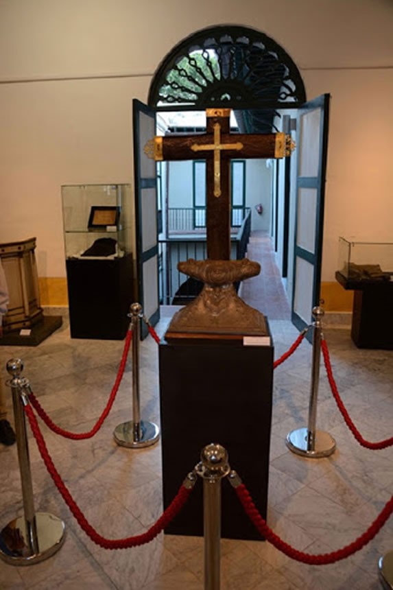 wooden cross with golden details on display