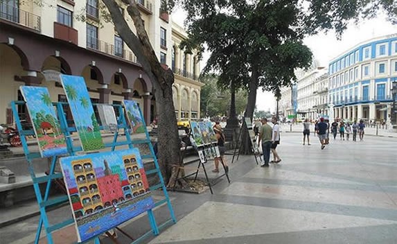 view of exhibition of paintings in Paseo del Prado