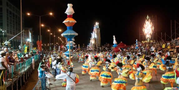 Colorful parade with dances and caravans.