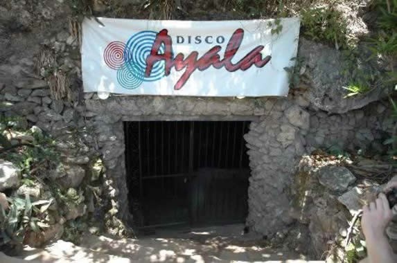 cave entrance with welcome sign