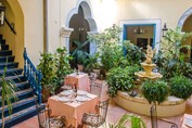 interior patio with iron furniture and fountain