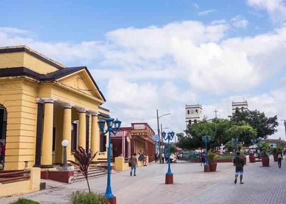 park surrounded by colonial buildings