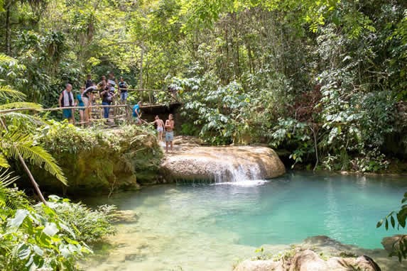 lagoon surrounded by vegetation and rocks